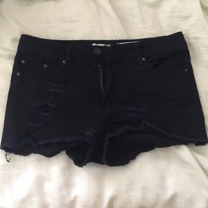 Ripped black shorts